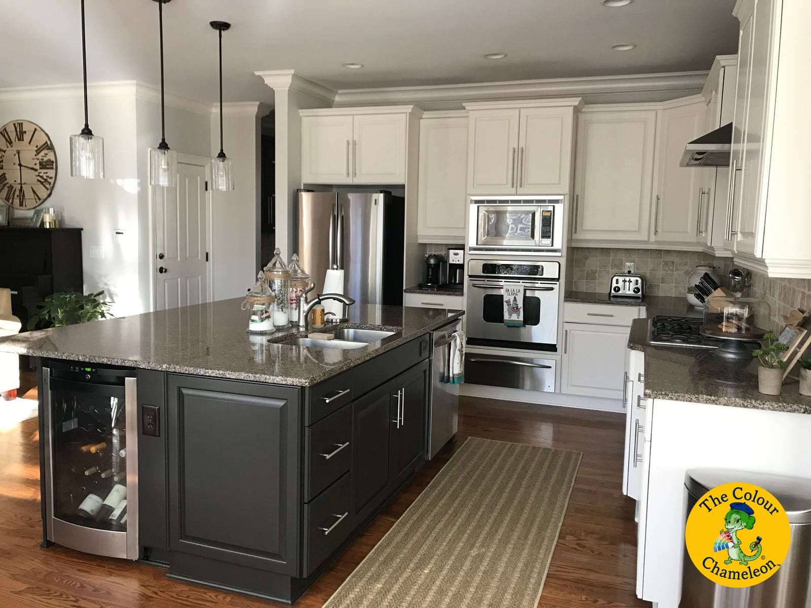 The same kitchen with the cabinets painted off-white and the island painted charcoal
